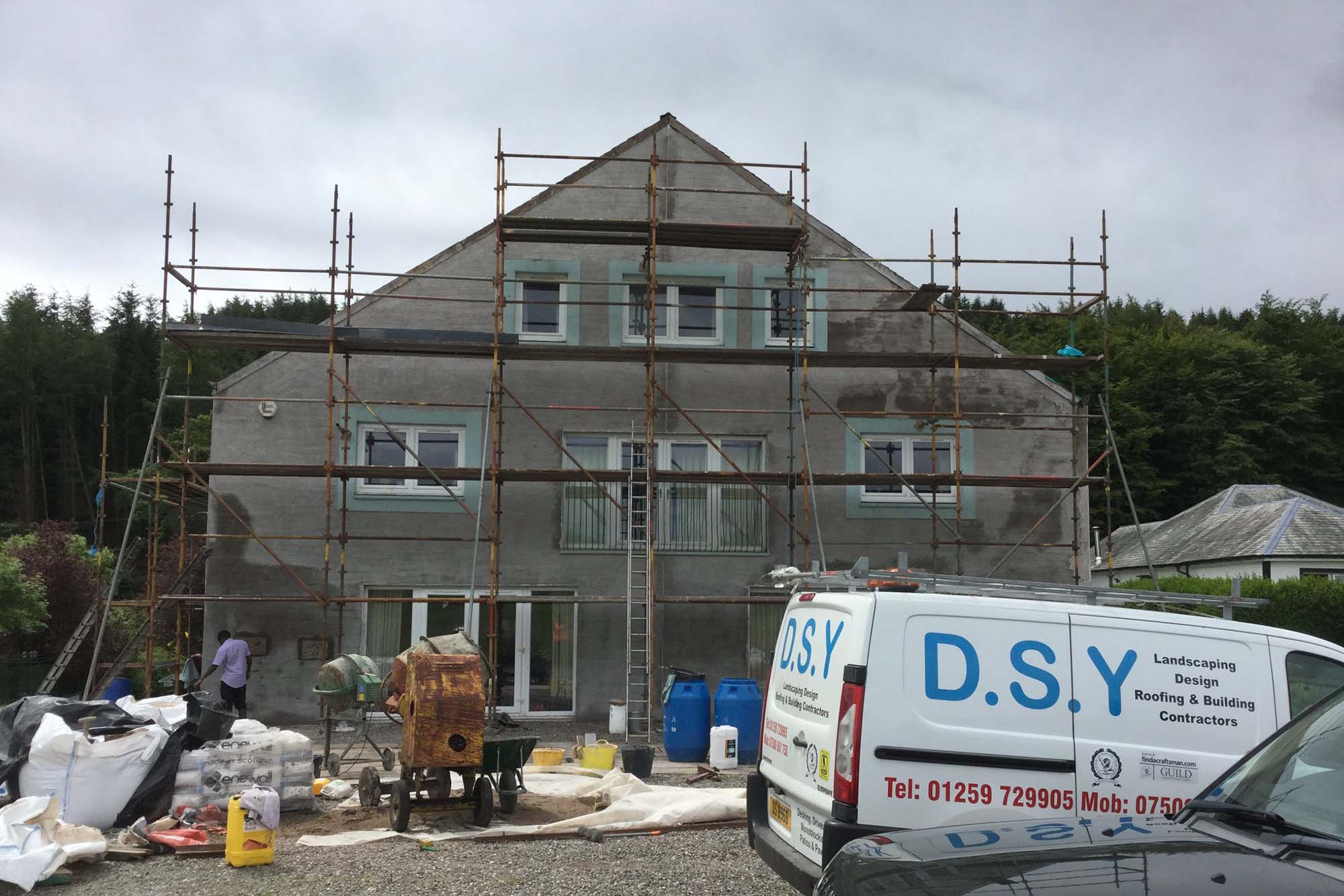 DSY van parked outside house getting new cladding